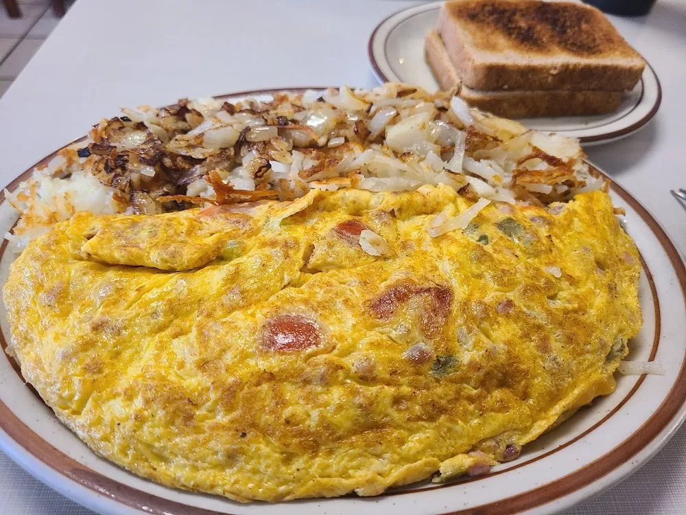 Western Omelet and Hashbrowns with Onions Cooked in The